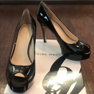 Black patent peep toe platform pumps